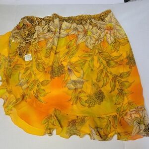 Rabbit Rabbit brand sarong skirt in vibrant yellow and orange colors with beauti